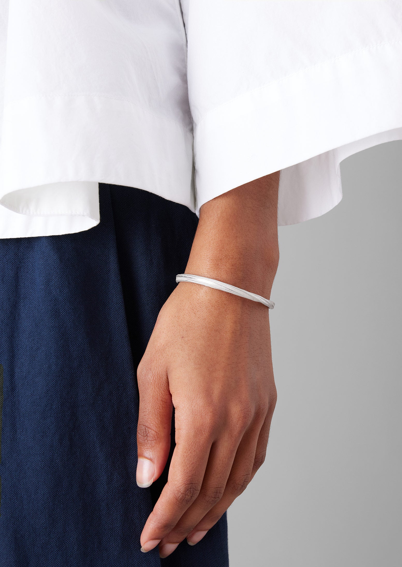 Silver Mitsuro Ribbon Bangle by Emily Nixon